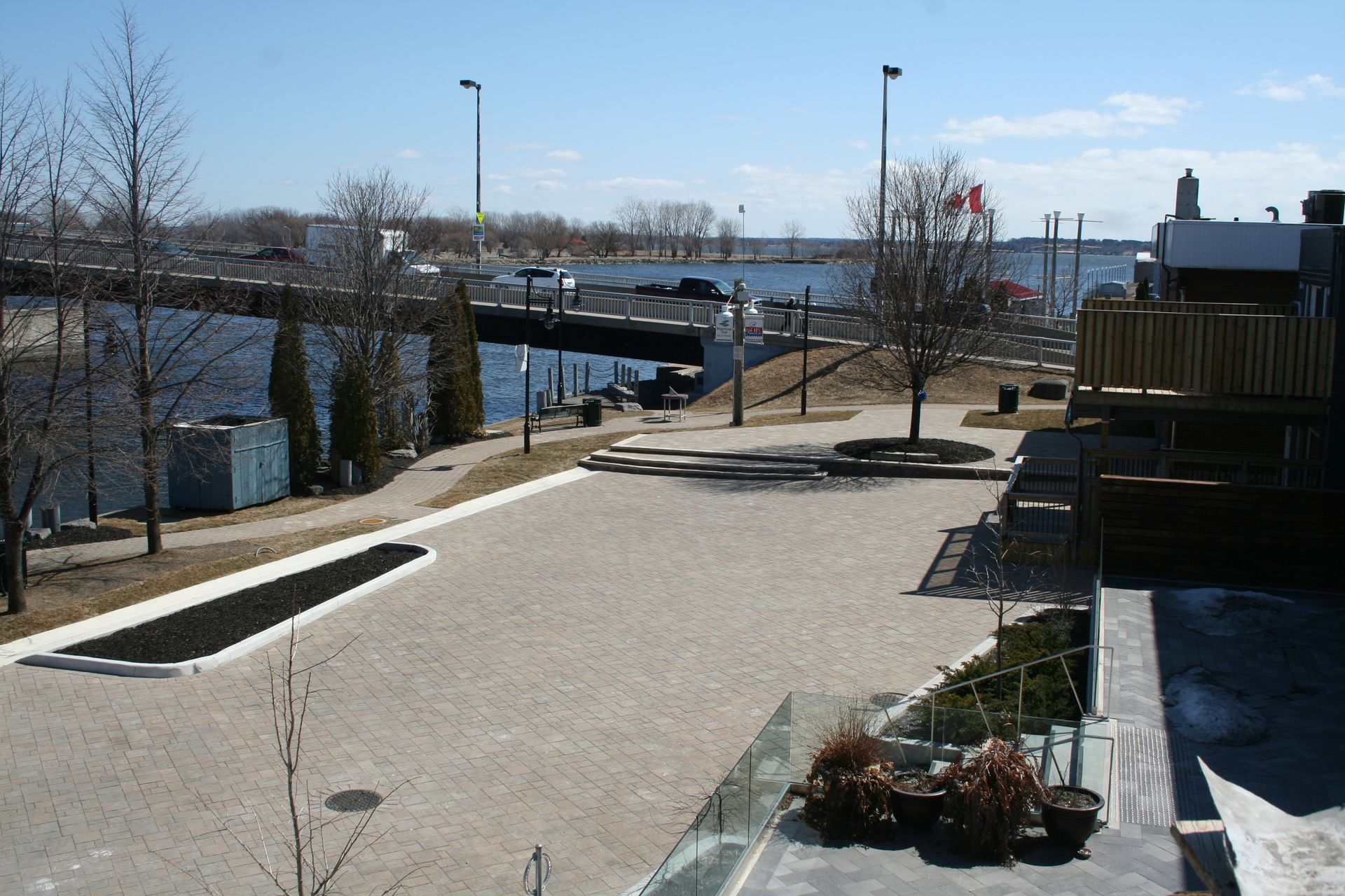 A view of a river with a bridge in the background