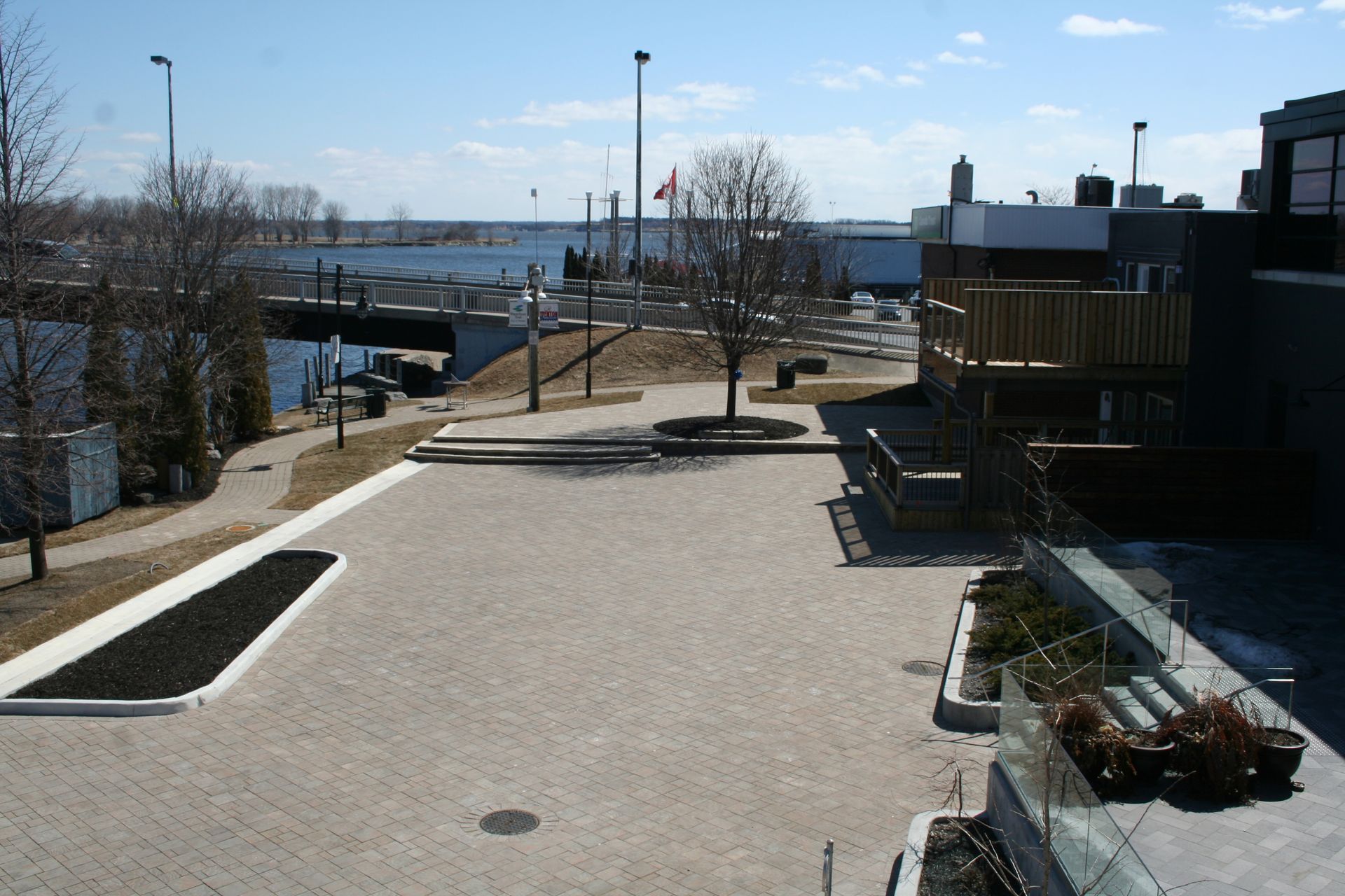 A parking lot with a view of a body of water