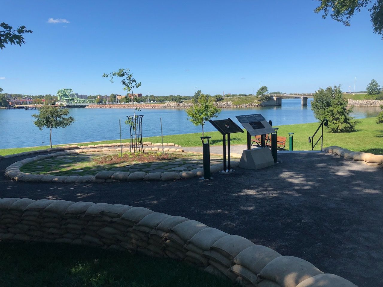 A park with a large body of water in the background