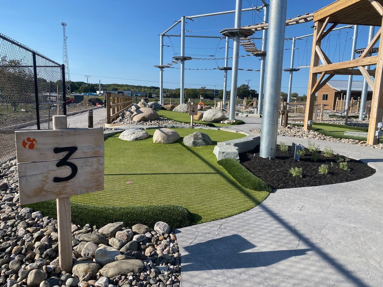 A wooden sign with the number 3 on it