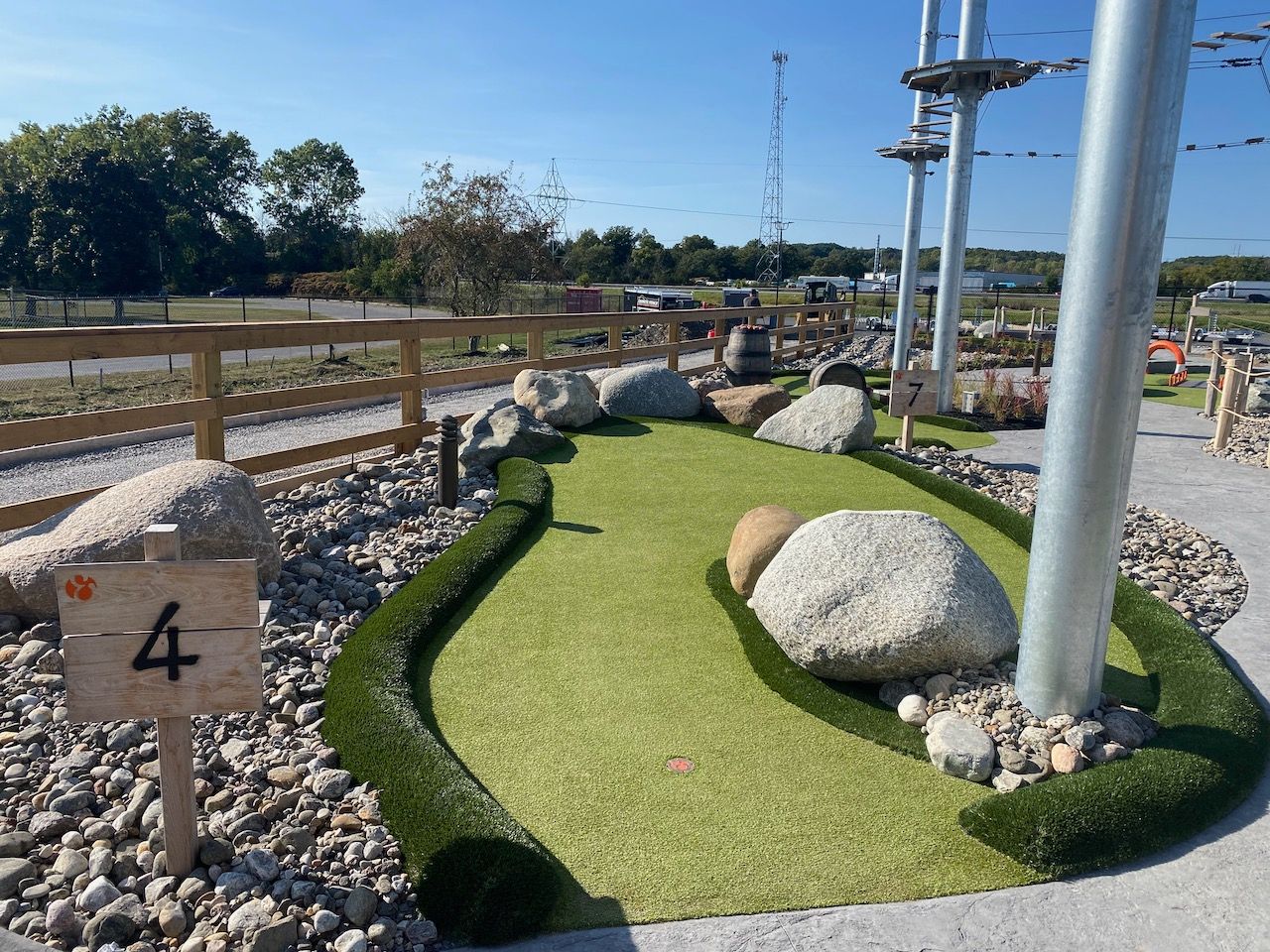 A small golf course with a sign that says 4 on it