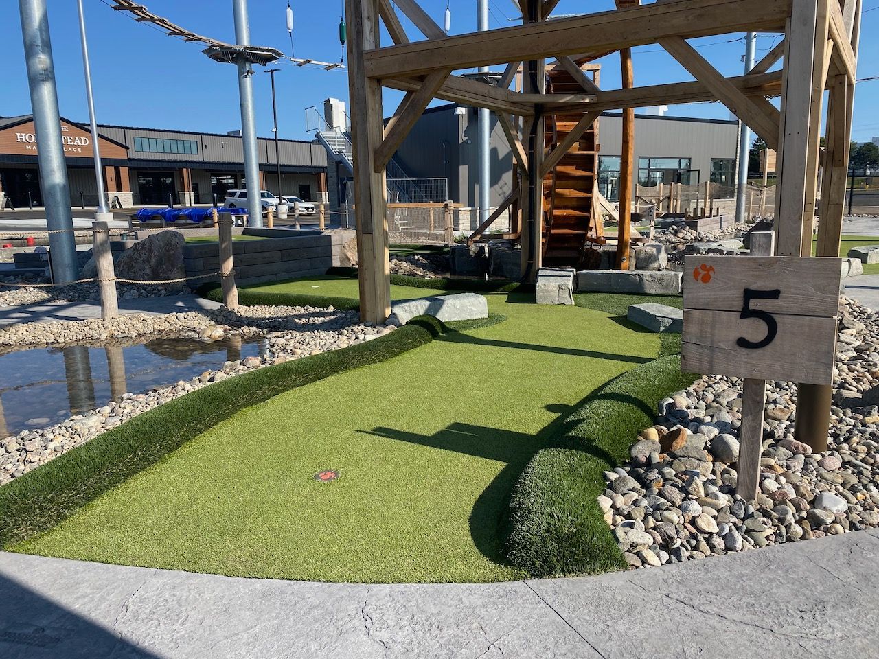 A wooden sign with the number 5 on it