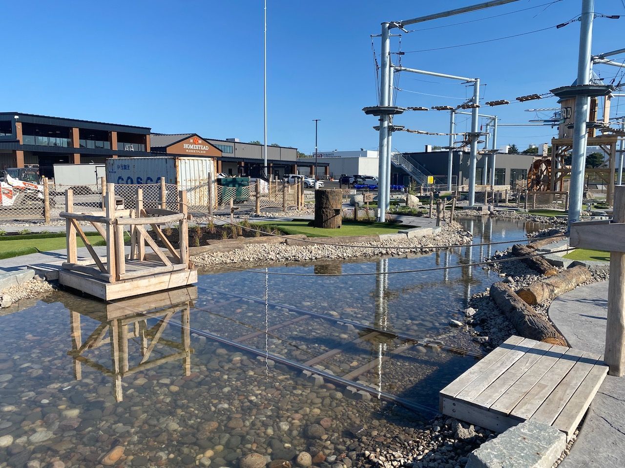 A wooden structure is sitting in the middle of a body of water.