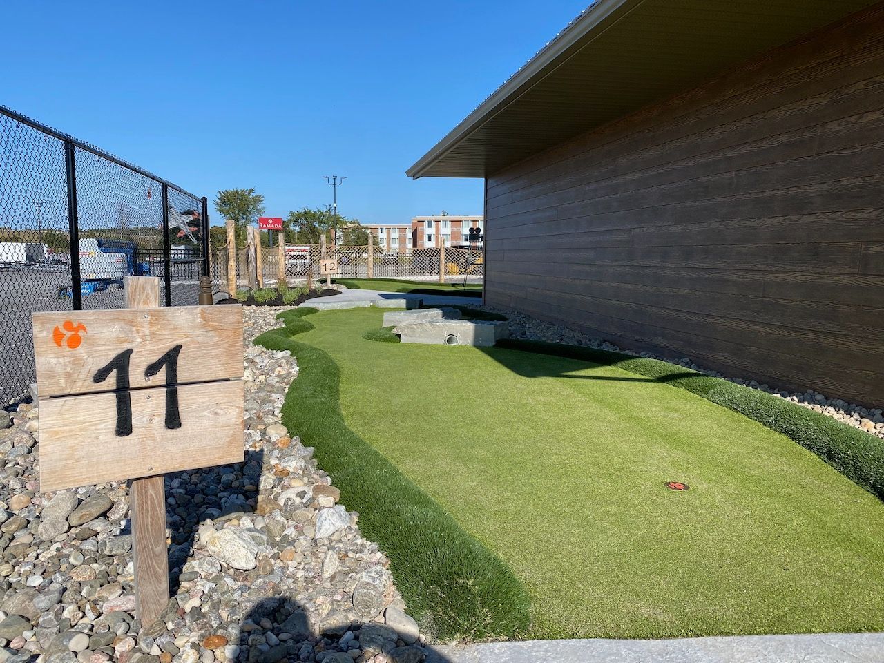 A wooden sign with the number 11 on it