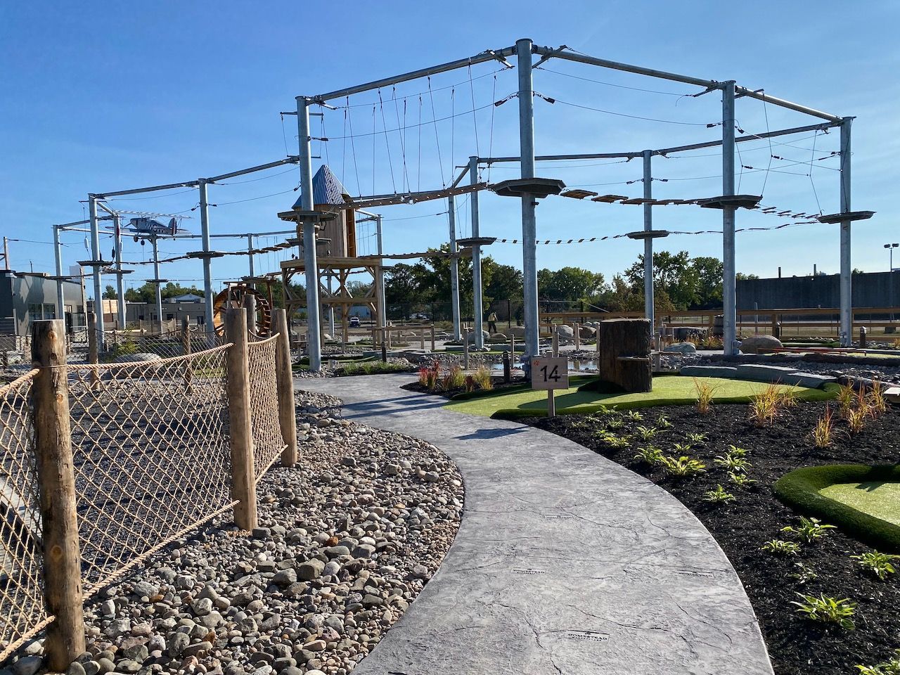 A path leading to a ropes course in a park