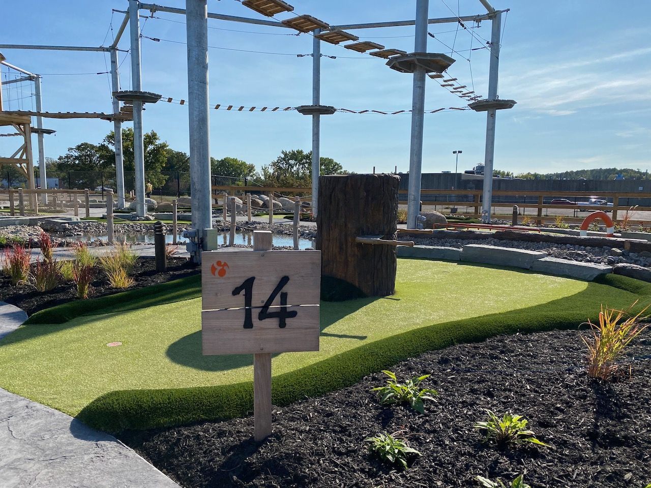 A wooden sign with the number 14 on it