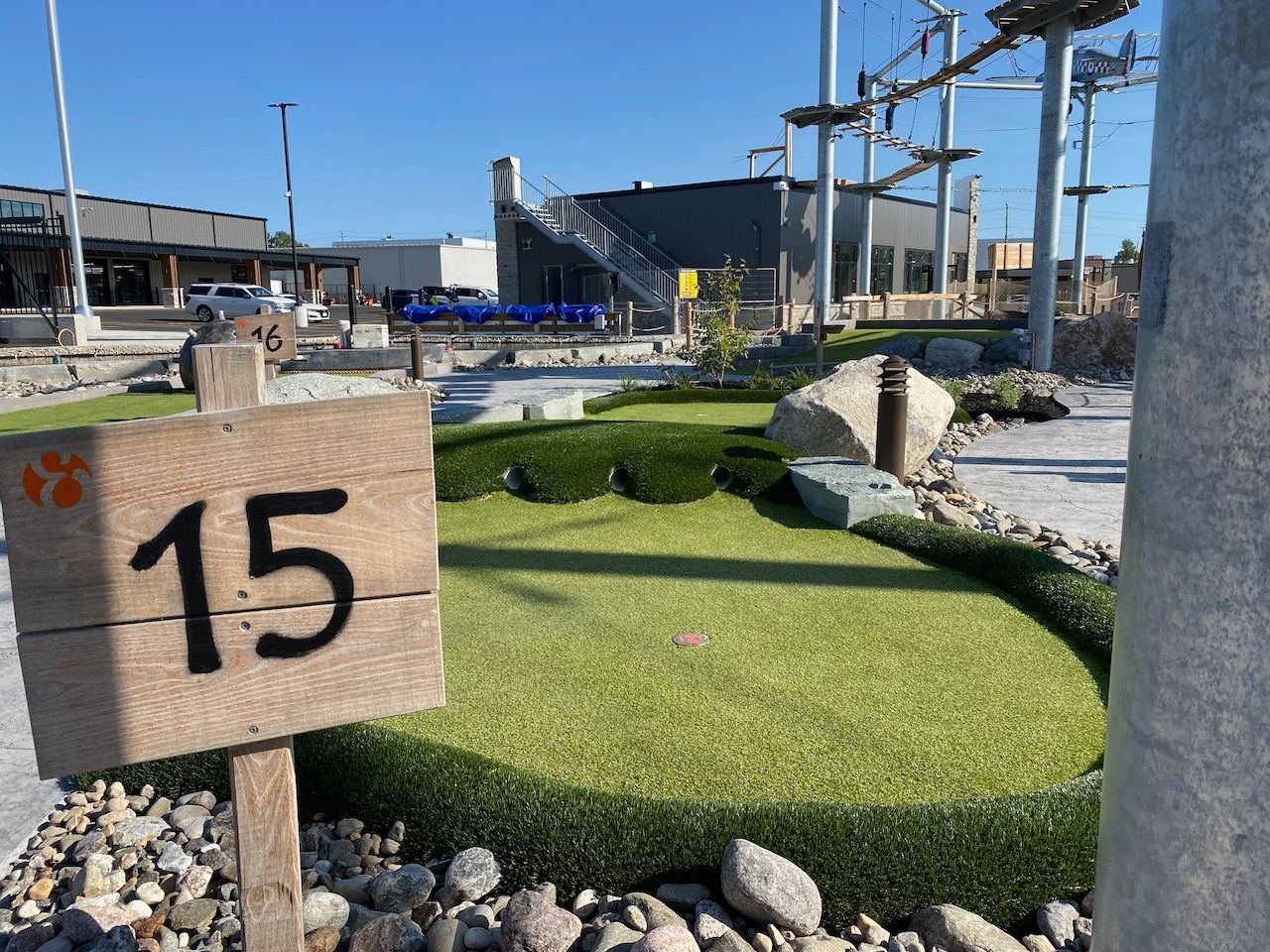 A wooden sign with the number 15 on it