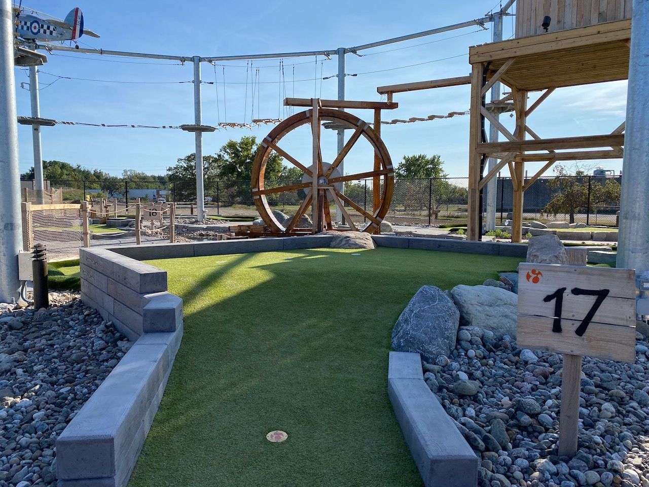 A golf course with a sign that says 17 on it