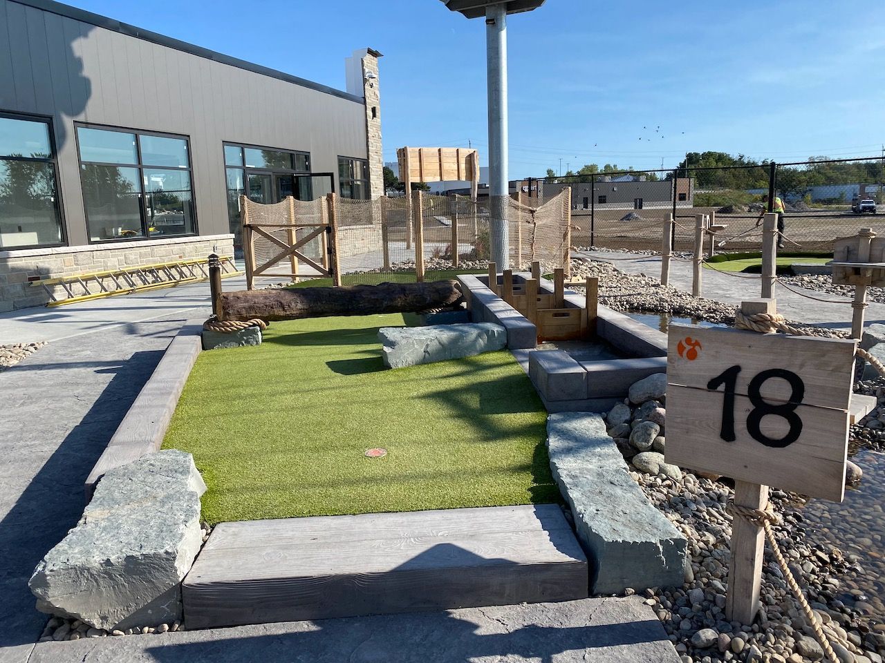 A golf course with a sign that says 18 on it