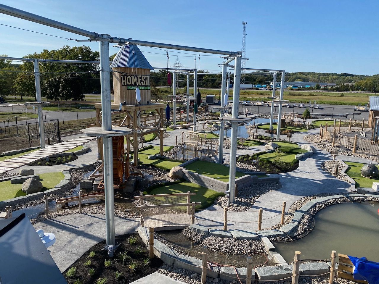 An aerial view of a ropes course in a park.