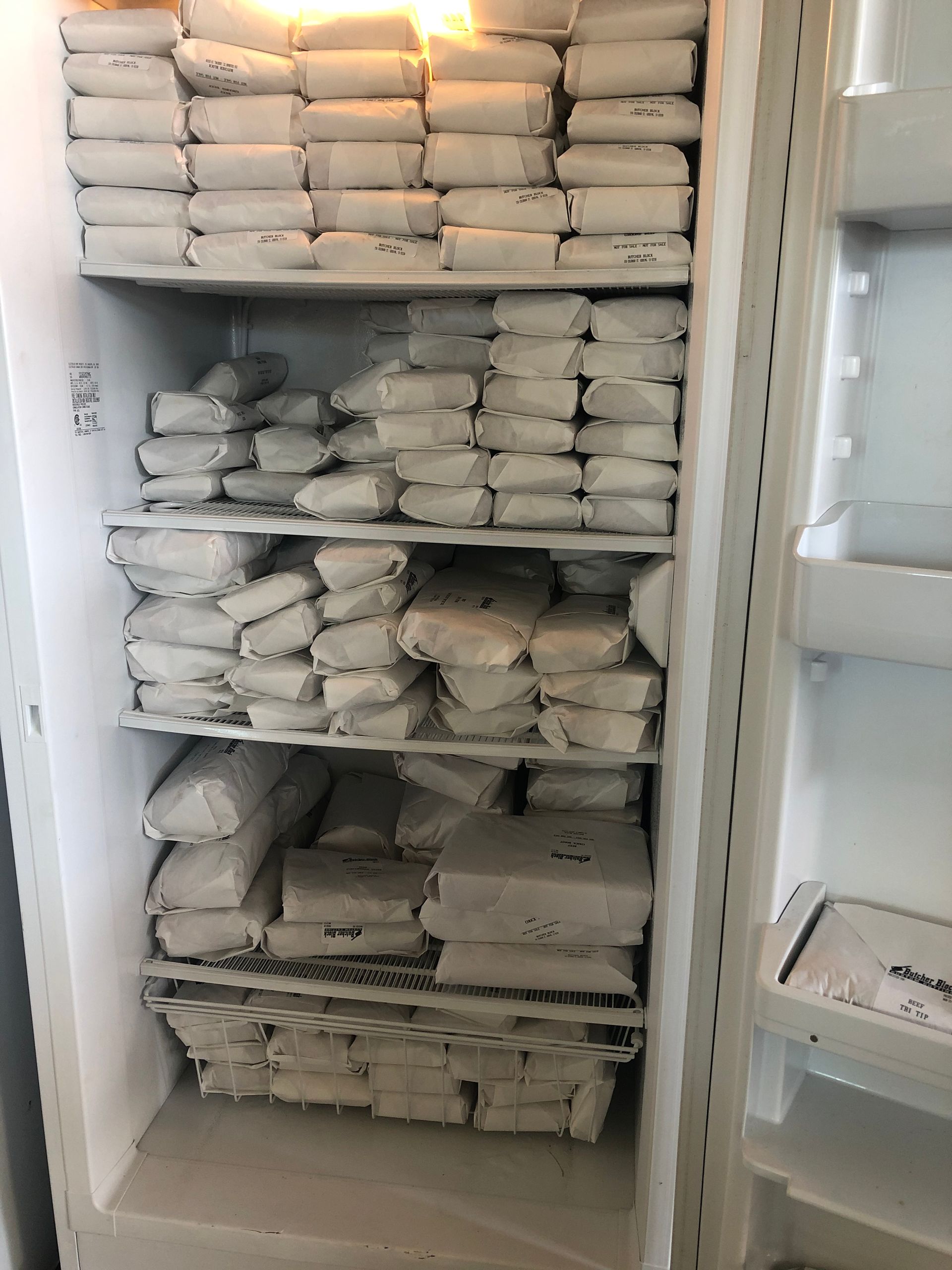 The inside of a refrigerator filled with lots of food.
