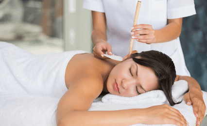 A lady having ear candle therapy