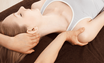 A lady having a neck and shoulder massage