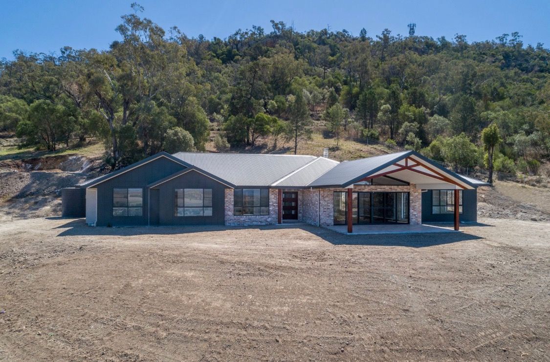 A newly built house with dirt out the front — L & K Electrical & Air Conditioning in Tamworth, NSW