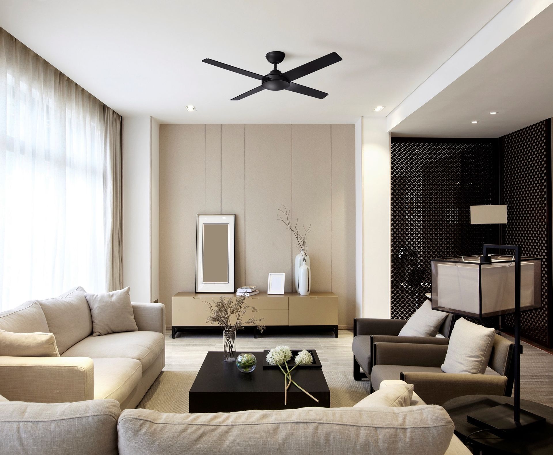 Living room with neutral colour scheme, featuring a ceiling fan, sofa, and decorative elements — L & K Electrical & Air Conditioning in Narrabri, NSW