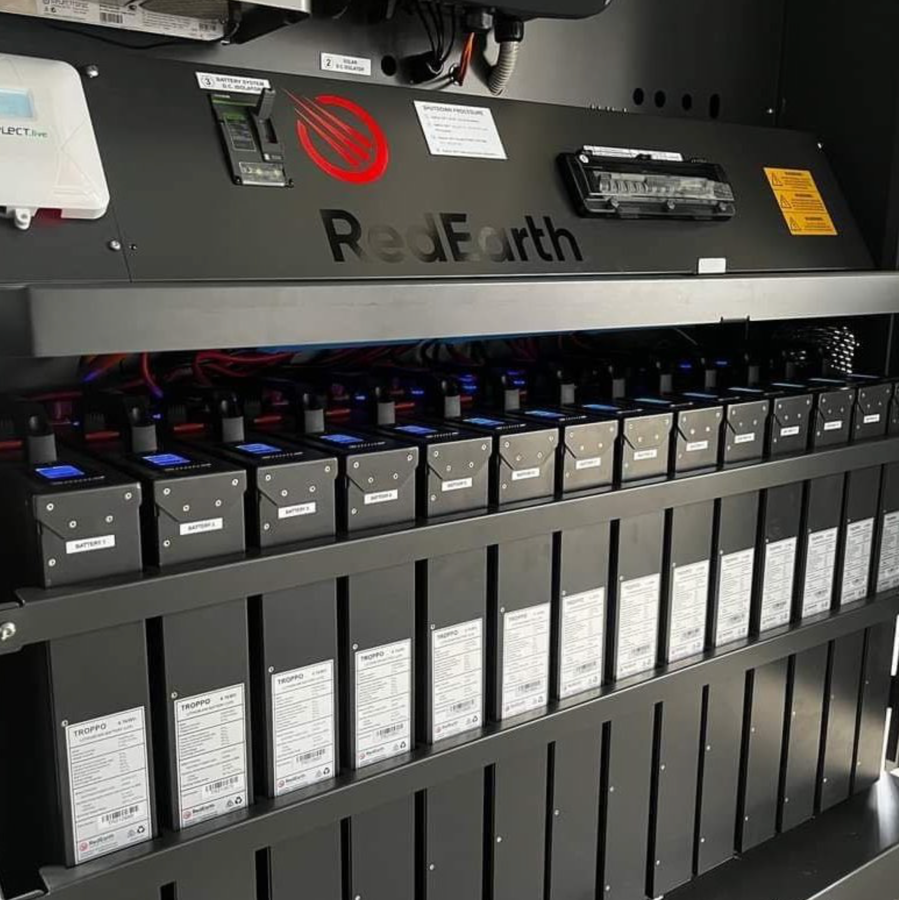 A Row of Batteries Are Lined Up in a Room — L & K Electrical & Air Conditioning in Narrabri, NSW