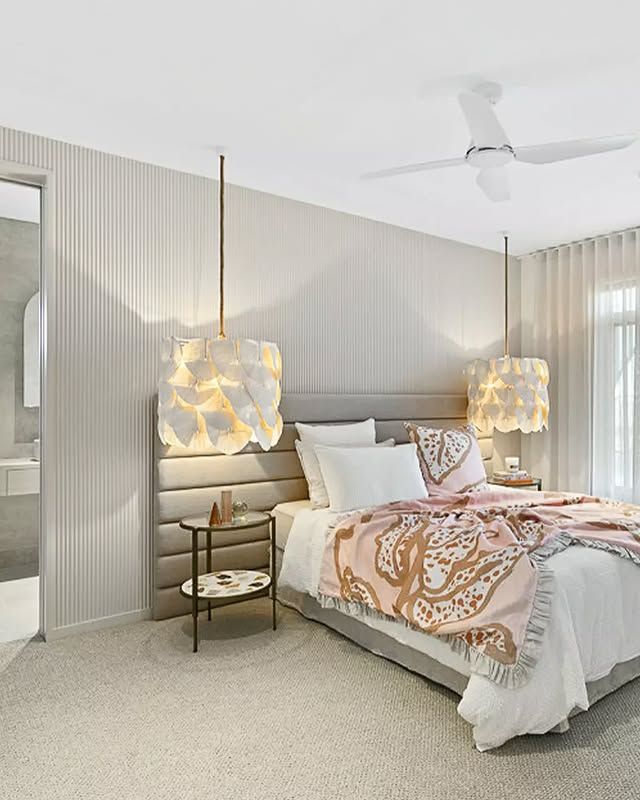 Bedroom with pendant lights, neutral tones, bed, and side table — L & K Electrical & Air Conditioning in Tamworth, NSW