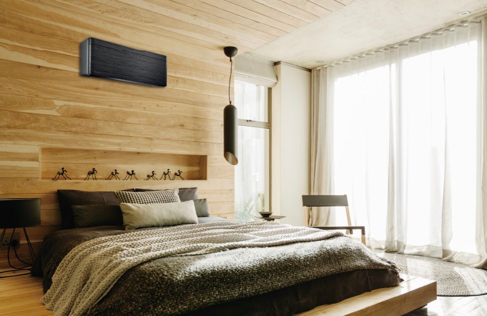 Bedroom with wood-panelled walls, bed, large windows, and a mounted air conditioner — L & K Electrical & Air Conditioning in Tamworth, NSW