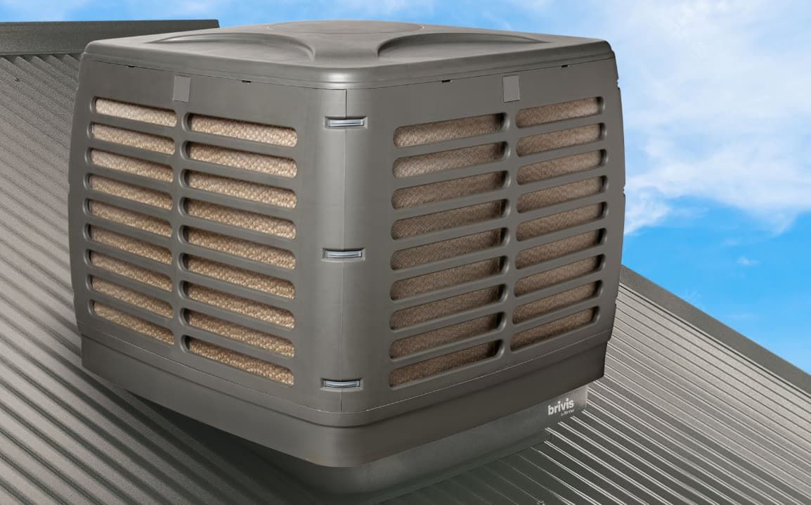 A Large Air Conditioner Is Mounted On The Roof Of A Building — L & K Electrical & Air Conditioning in Narrabri, NSW