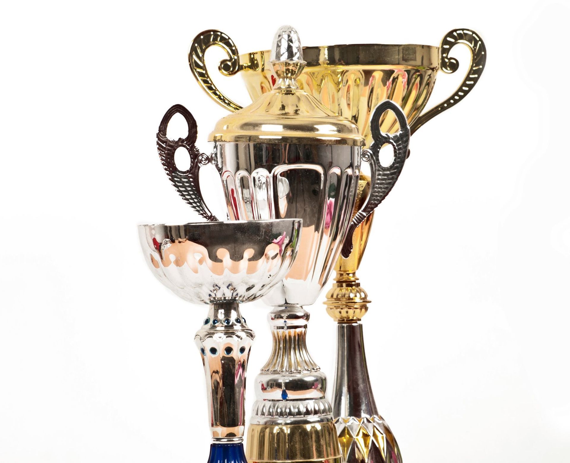Three trophies are stacked on top of each other on a white background
