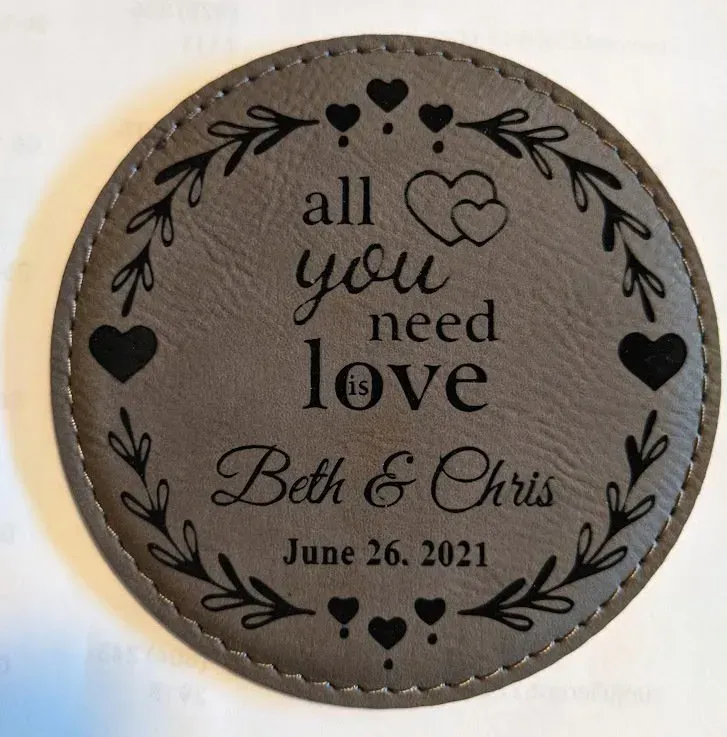 A coaster that says all you need is love