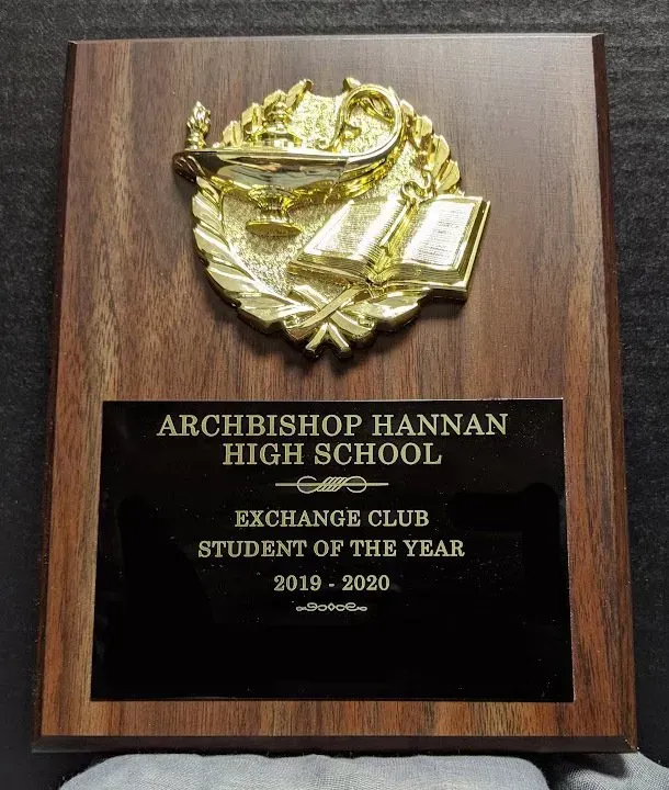 Wooden board with a gold plate plaque