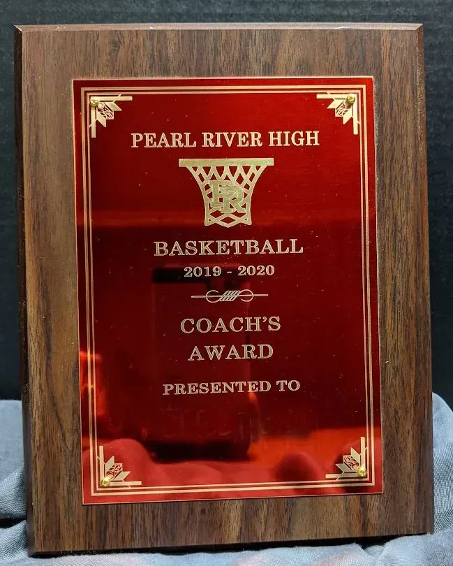 A plaque for pearl river high basketball coach 's award