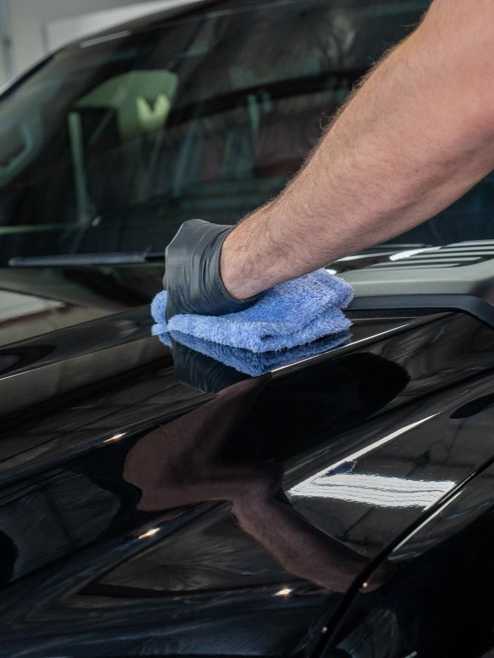 Two men are working on a jet ski in a garage