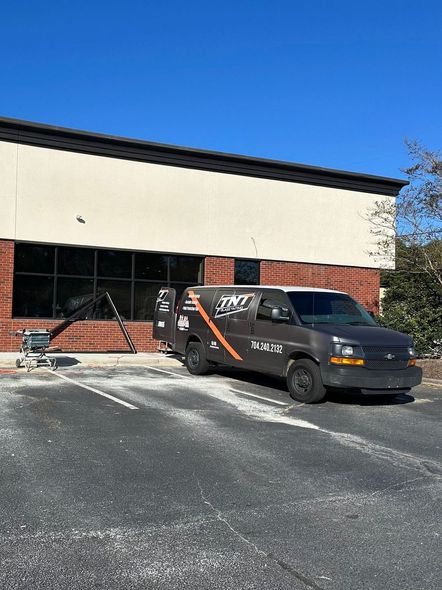 A van is parked in front of a building.