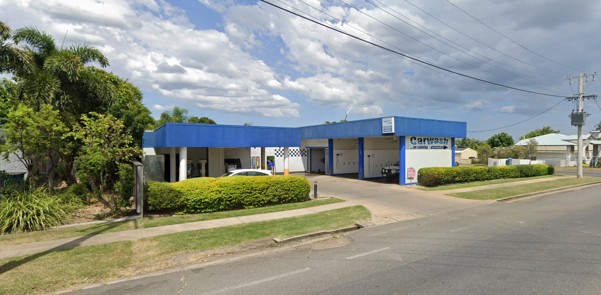 A Person Is Cleaning A Car Seat With A Steam Cleaner — Carwash On Canning In Allenstown, QLD
