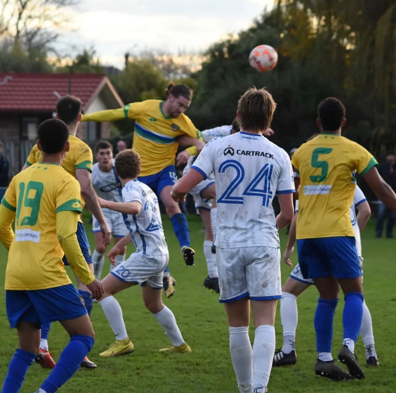 A soccer player with the number 24 on the back of his jersey