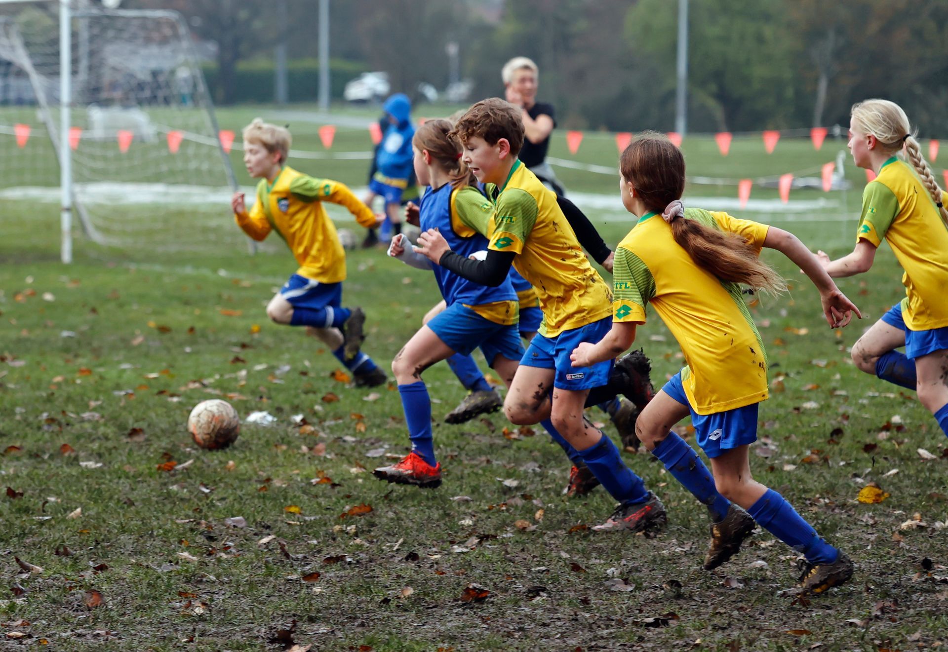 Two young boys are holding a picture frame that says players of the day.
