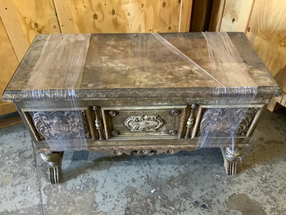 Water-damaged heirloom chest after furniture restoration