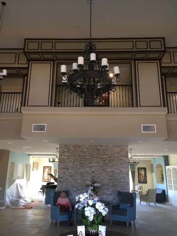 A large room with a chandelier hanging from the ceiling