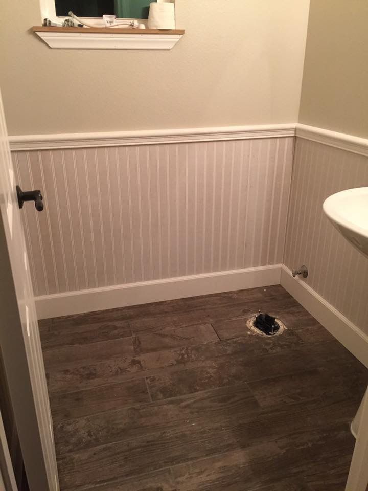 A bathroom with a sink and a window