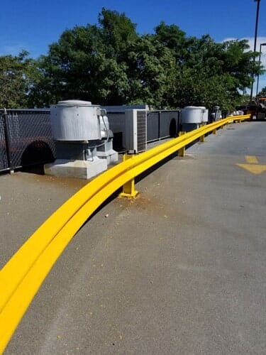Yellow guard rail along the road—Security Fence in Bronx, NY