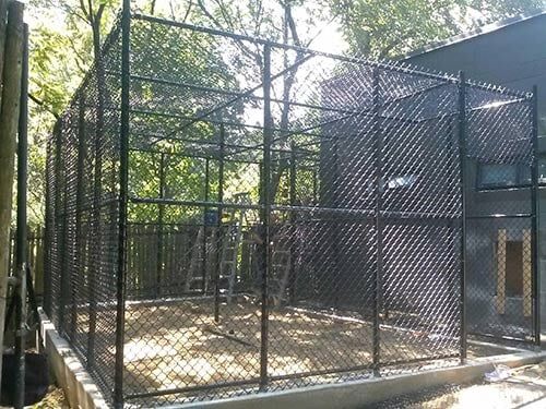 Black enclosures in side view — Fence Installation in Bronx, NY
