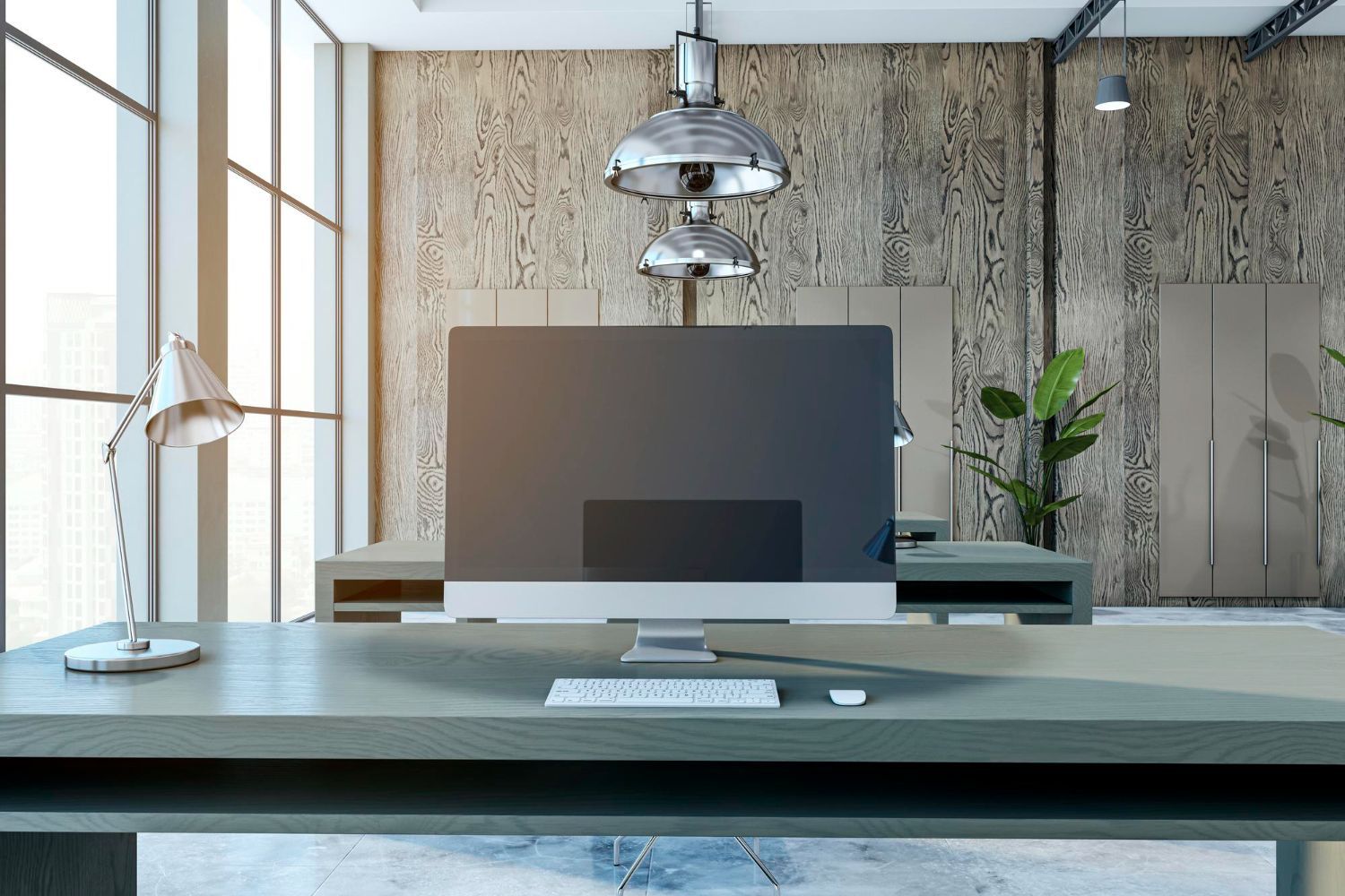 A computer monitor is sitting on top of a wooden desk in an office.