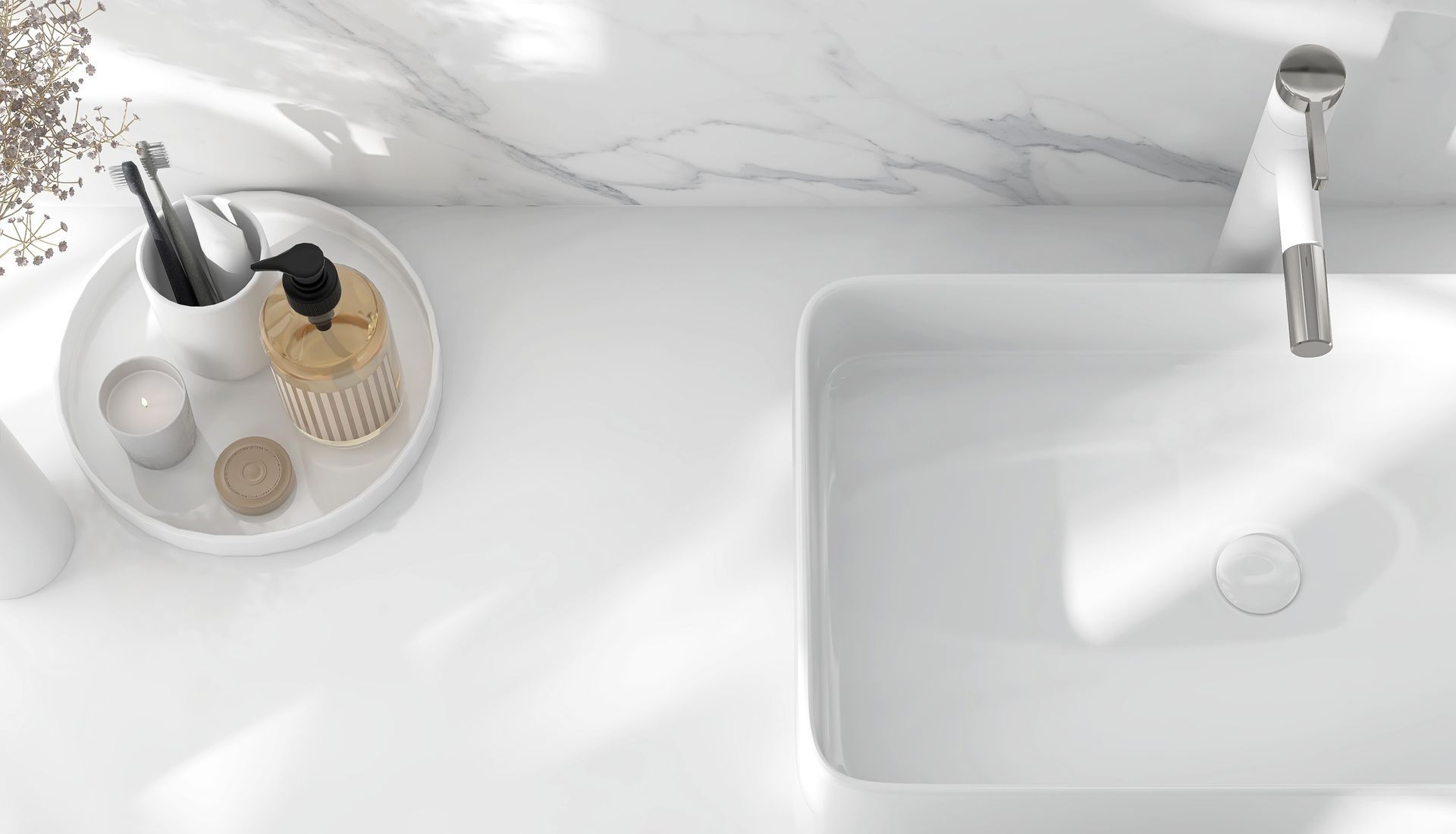 A bathroom sink with a tray of soap and brushes on it.