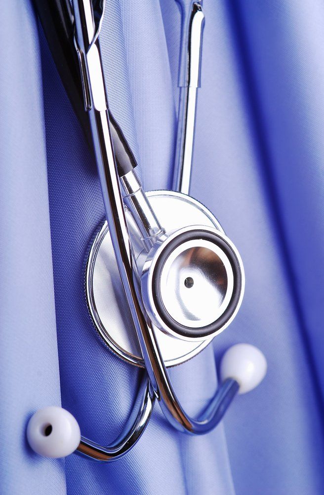 A close up of a stethoscope on a blue cloth