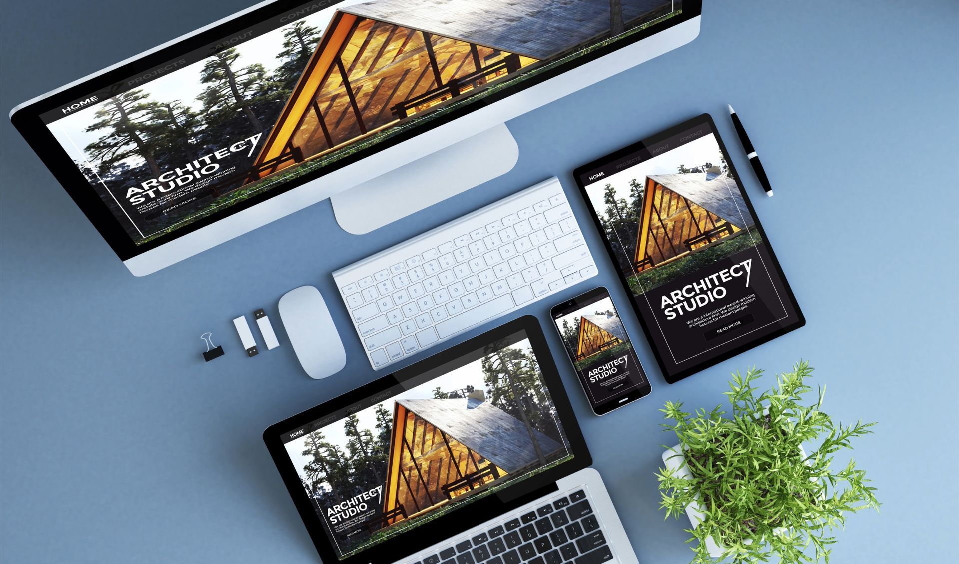 Website design concept displayed on various devices including a desktop, laptop, tablet, and phone.