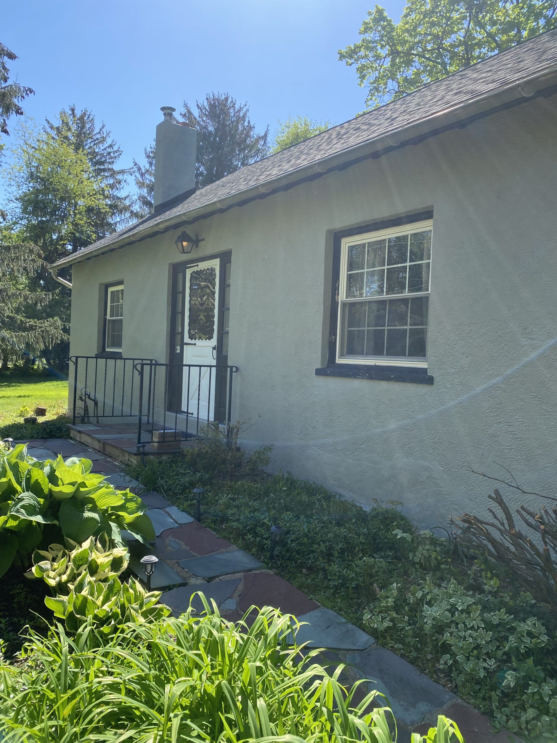 A small house with a walkway leading to it