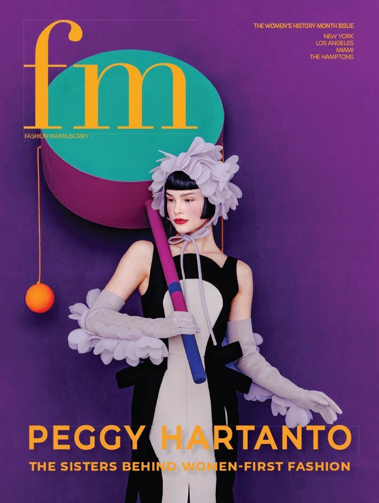 A woman in a black and white dress with lavender gloves on a dark purple background