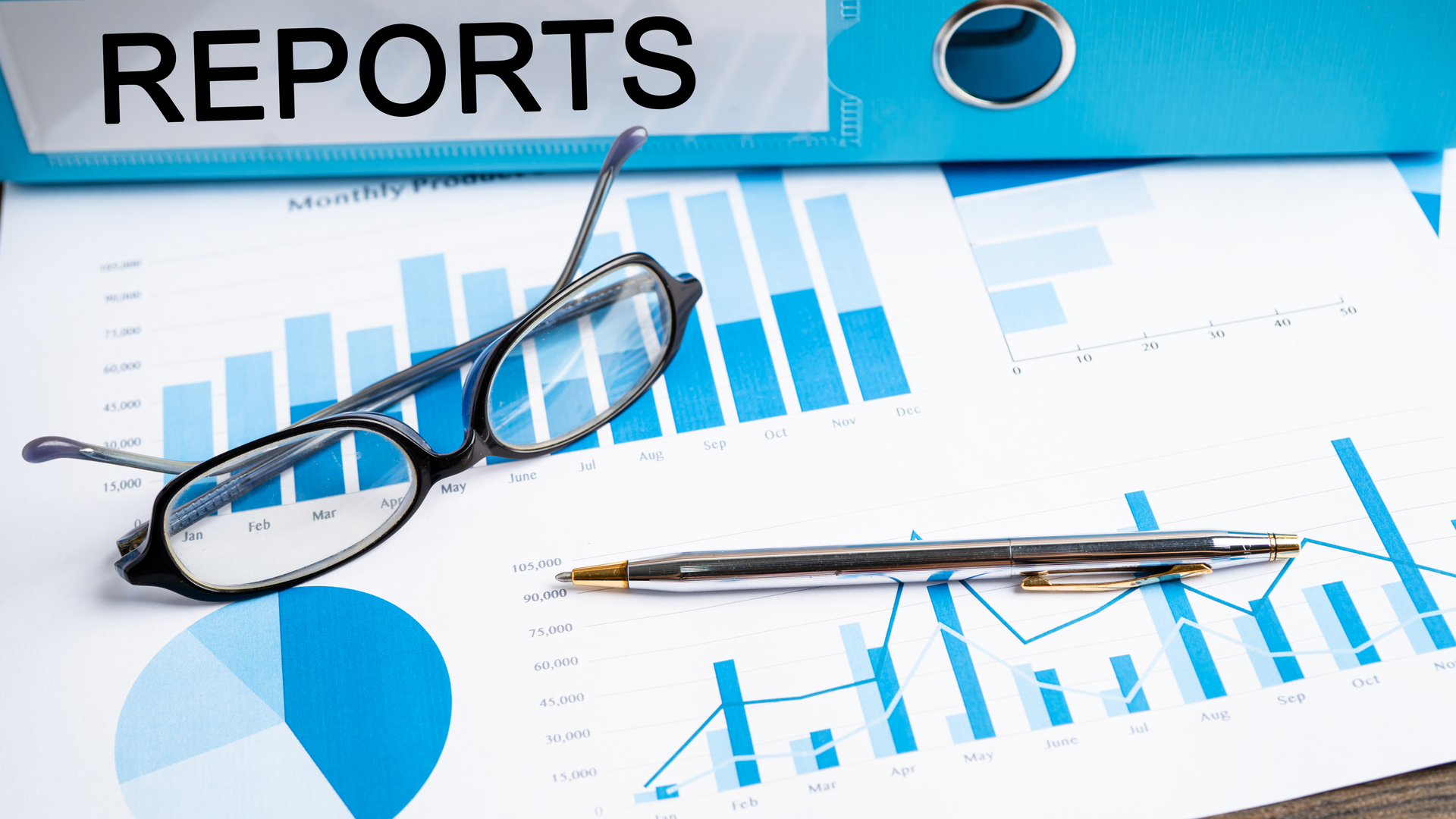 A man is using a broom to spread concrete on a sidewalk.