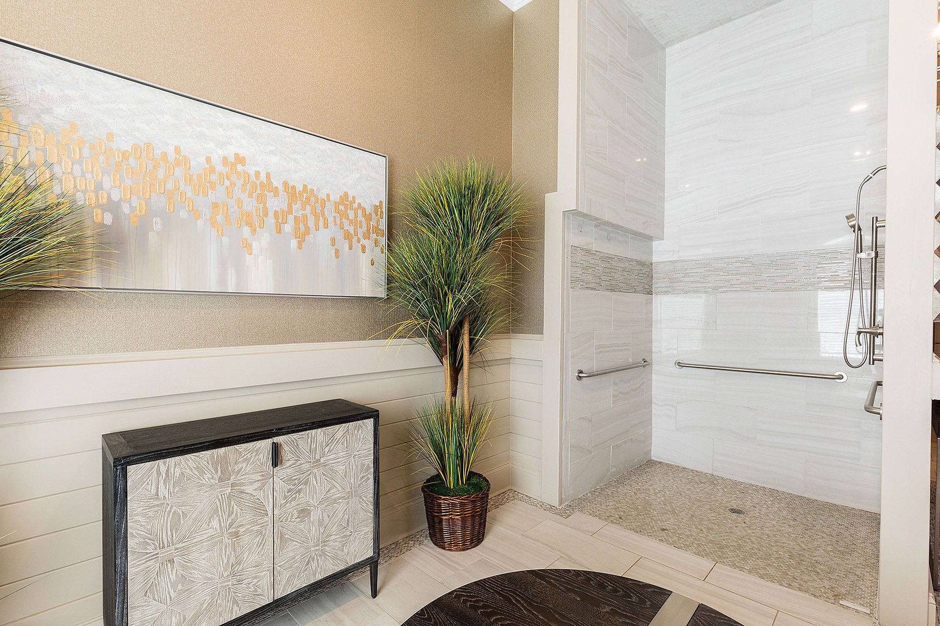 Accessible bathroom with walk-in tiled shower and grab bars.