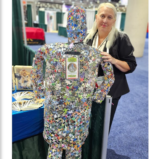Jodi Jill Founder of International Puzzle Day with jigsaw puzzle art