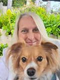 Jodi Jill founder of  Puzzle Day with her adopted dog, June Bug