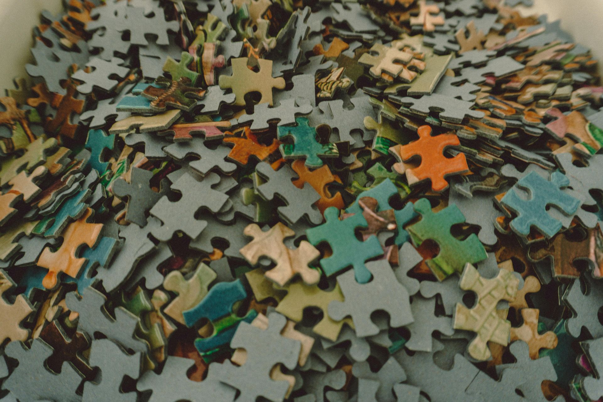 Jigsaw Puzzle Pieces on a table for International Puzzle Day events