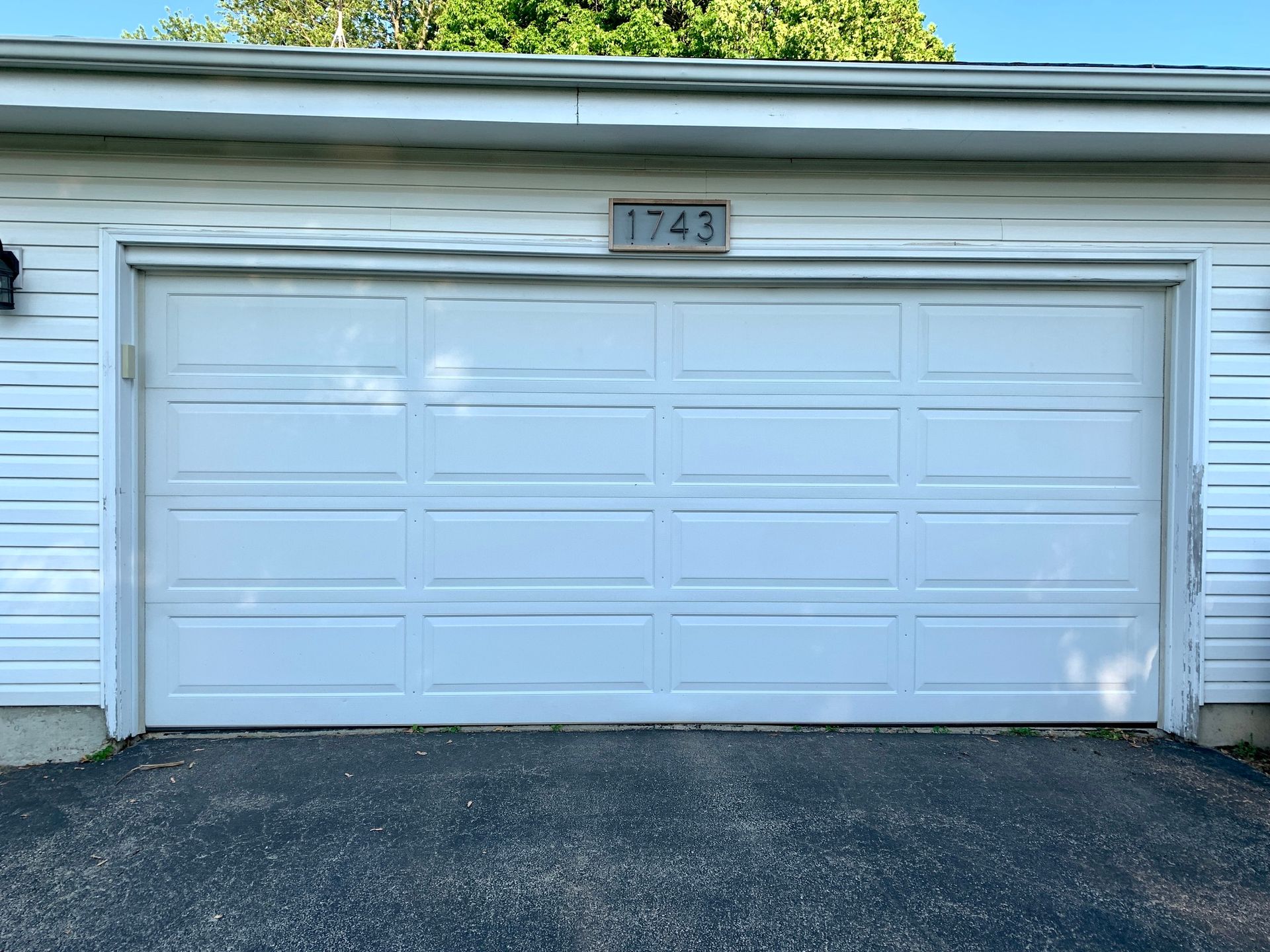 White garage door with house number 1743 above.