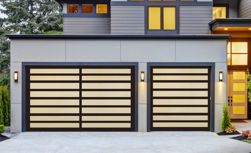 Two modern garage doors with beige horizontal panels and black frames on a gray house.